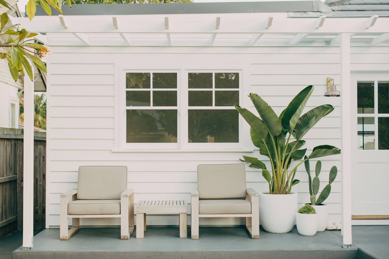 Covered deck and outdoor living area with a pergola at the North Narrabeen home