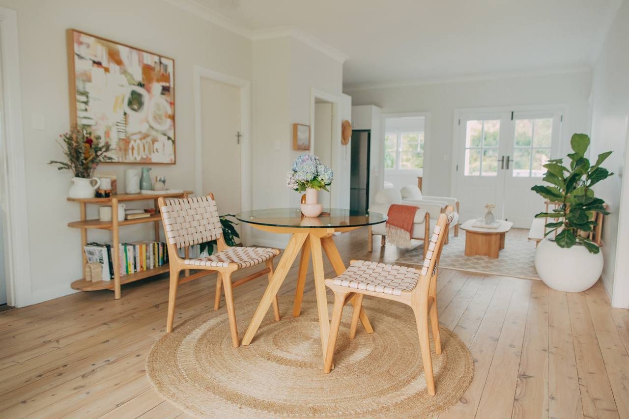Open-plan living area with natural light and timber flooring at the North Narrabeen home